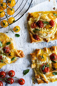 Cheese and tomato puff pastry tarts