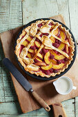 Summery peach pie with raspberries