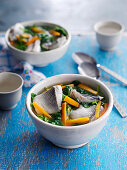 Healthy fish soup with carrots and pak choi (China)