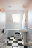 Classic bathroom with vintage-style sink and chequered floor