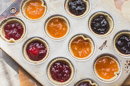 Jam tarts in a muffin tin