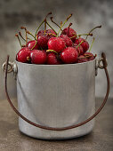 Cherries in a metal bucket