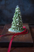 A Christmas tree cake made from honey cake and decorated with butter cream