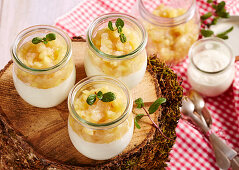Vanilla quark cream with apple and pear compote in jars to take away