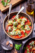 Potato and spinach gnocchi in tomato sauce