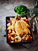 Roast chicken with lemon and rosemary roots