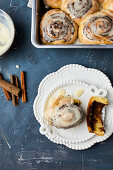 Baked cinnamon rolls with sugar glaze on top