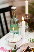 Candles and food on table