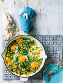 Pea, spinach and corn skillet eggs