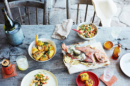 Whole Barbecued fish with chilli and peach salsa, Corn with herb butter and chipotle salt