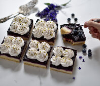 Vegan blueberry and quark semolina cake with cream and chopped pistachios