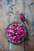 Roses drying on silver plate