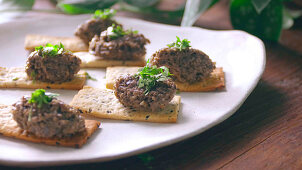 Make tapenade and sesame crackers