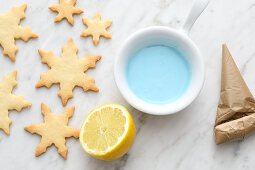Snowflake biscuits with blue icing