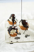 Mini almond muffins with vanilla ice cream and chocolate sauce