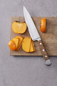 Persimmon being sliced