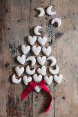 Heart-shaped and crescent biscuits arranged in the shape of a Christmas tree