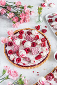 Raspberry tart with mascarpone, ruby chocolate and meringues