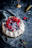 Pavlova cake with forest fruits and mascarpone