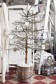 Small Christmas tree made of spruce decorated with white hearts