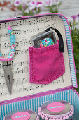 Handmade, feminine tool box in shades of pink and pale blue