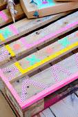 Pallet covered with colored washi tape