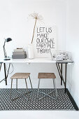 Slimline desk and two stools on black-and-white patterned rug