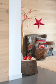 Vintage leather armchair and tree-stump side table in festively decorated room