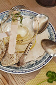 A small bowl of honey on a plate for breakfast