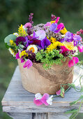 Summer bouquet of sweet peas, everlasting flowers, chrysanthemums, goldenrod, and spinach seeds