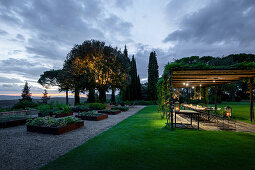 Set table in seating area on terrace at twilight