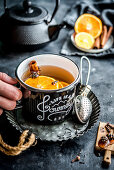 Mulled tea with oranges, cloves, cinnamon and Siberian cones
