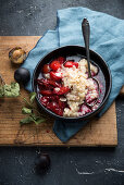 Vegan almond rice pudding with plum compote