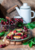 Chocolate and vanilla pancakes with cherry filling made from cottage cheese (syrniki)
