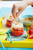 Kid serving berry granola