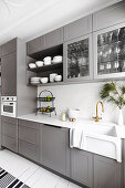 Light gray fitted kitchen with ceramic sink