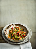 Slow cooked vegetable curry with flatbread