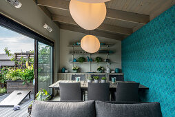 Modern dining room with blue wall in summerhouse