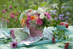 Bouquet of roses, wild carrot, cumin and gooseberry, heart with a message: summer party