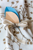 Handmade napkin ring made from paper and ribbons