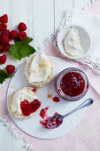 Raspberry and gin jam with scones and clotted cream