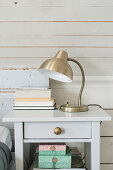 Silver vintage-style lamp on bedside table