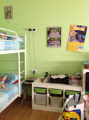 Bunk beds and storage solution with pull-out boxes in green sibling's bedroom