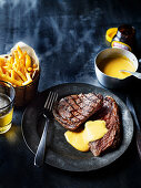 Steak and chips with spicy sauce Hollandaise