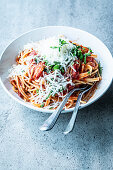 Noodles with tomato sauce and grated cheese
