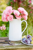 Bouquet of roses in milk jug