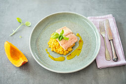 Pumpkin risotto with salmon trout and an orange and saffron sauce