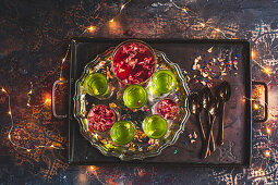 Festive lime and raspberry jelly with gin and edible flowers