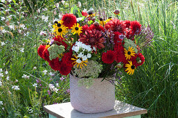 Lush bouquet from the cottage garden: dahlias, coneflowers, flame flower, sedum and verbena