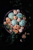 Peeled tangerine, melon cantalupe and dried hops branches